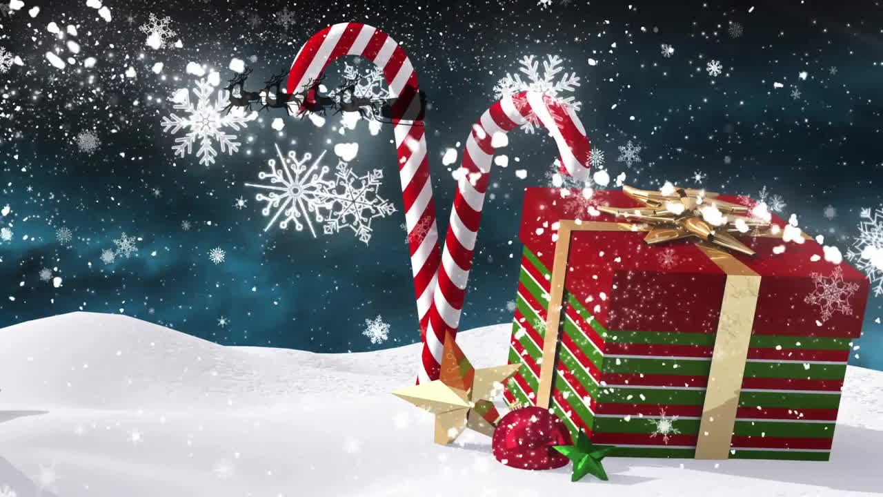 Animation of snow falling over christmas present and santa claus
