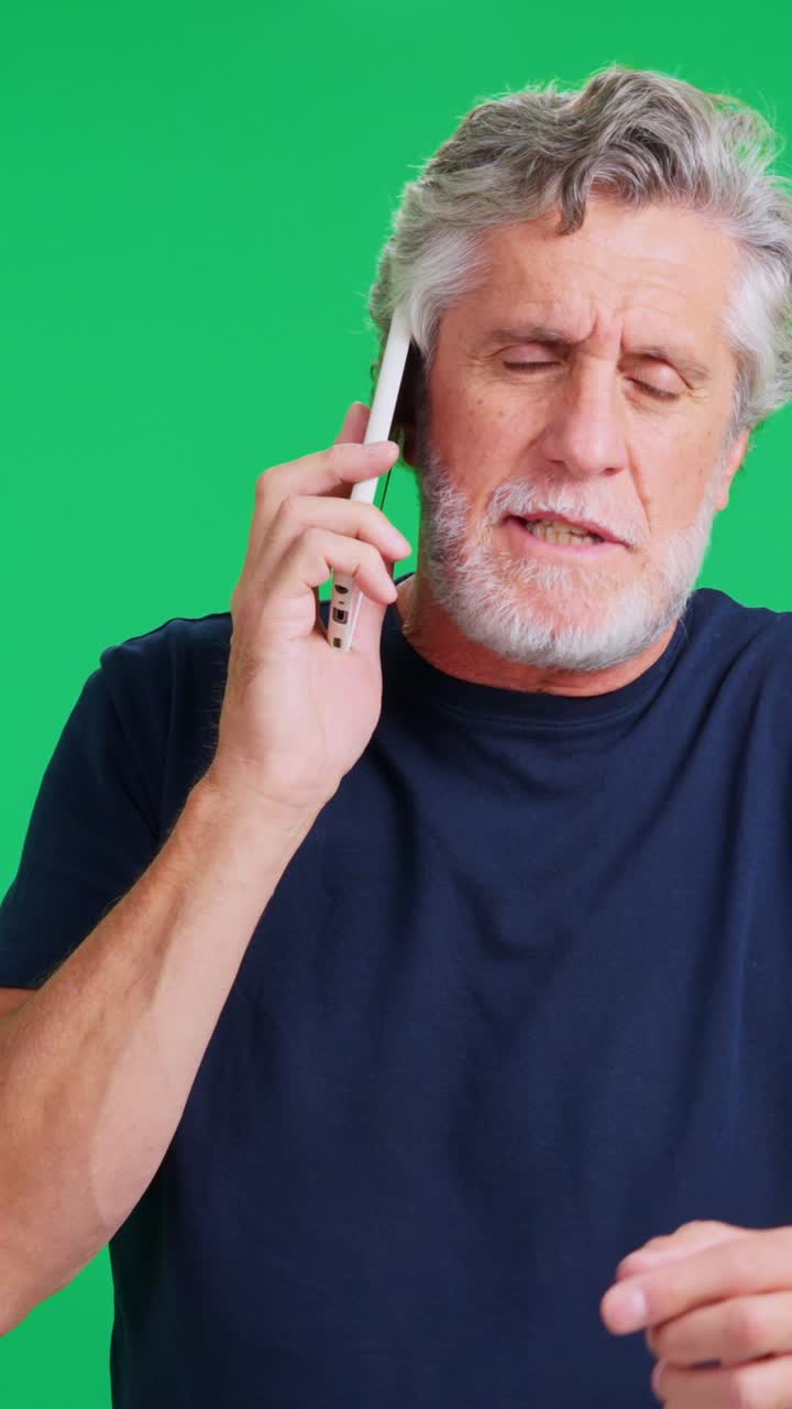 Concerned Senior Man Talking on Smartphone on Green Screen