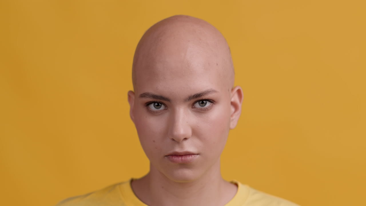 Bald Woman Portrait Against Yellow Background