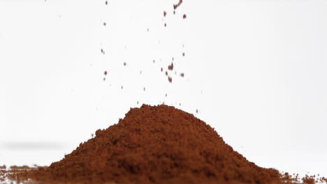 slow motion of brown powder falling