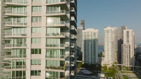 close-up view of facade with windows and balconies. modern high rise apartment building in urban borough. miami, usa