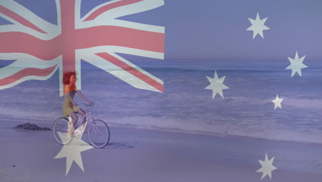 Riding-bicycle-on-beach,-woman-with-Australian-flag-animation-in-background