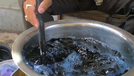 clothes being dyed blue