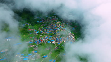 nepali village in pokhara green hill cloud drone shot