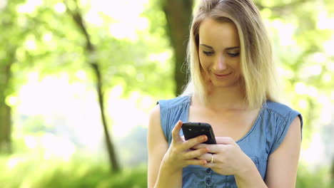 beautiful teen sending a text on her smartphone