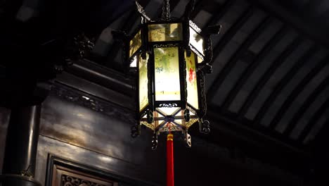 closeup of a vintage chinese decorative lantern adorned with floral motifs