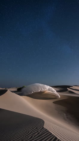 ethereal night in the desert: flowing forms amidst starry dunes