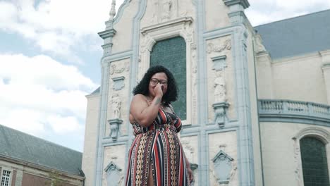 Extremely-hard-laughing-brown-skin-woman-in-the-town-of-Scherpenheuvel,-Belgium