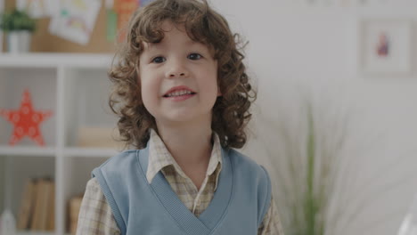 happy boy in classroom