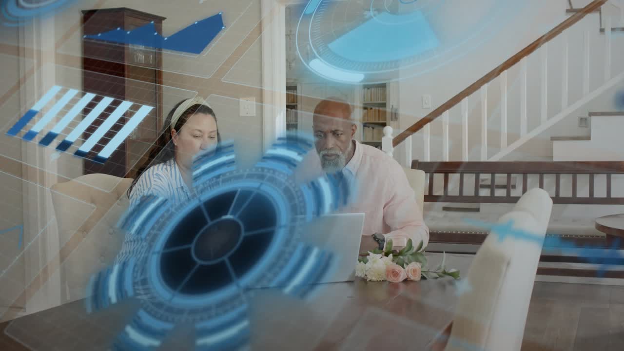 Woman pressing device keys, HUD growing over table while couple reviewing finance papers on laptop