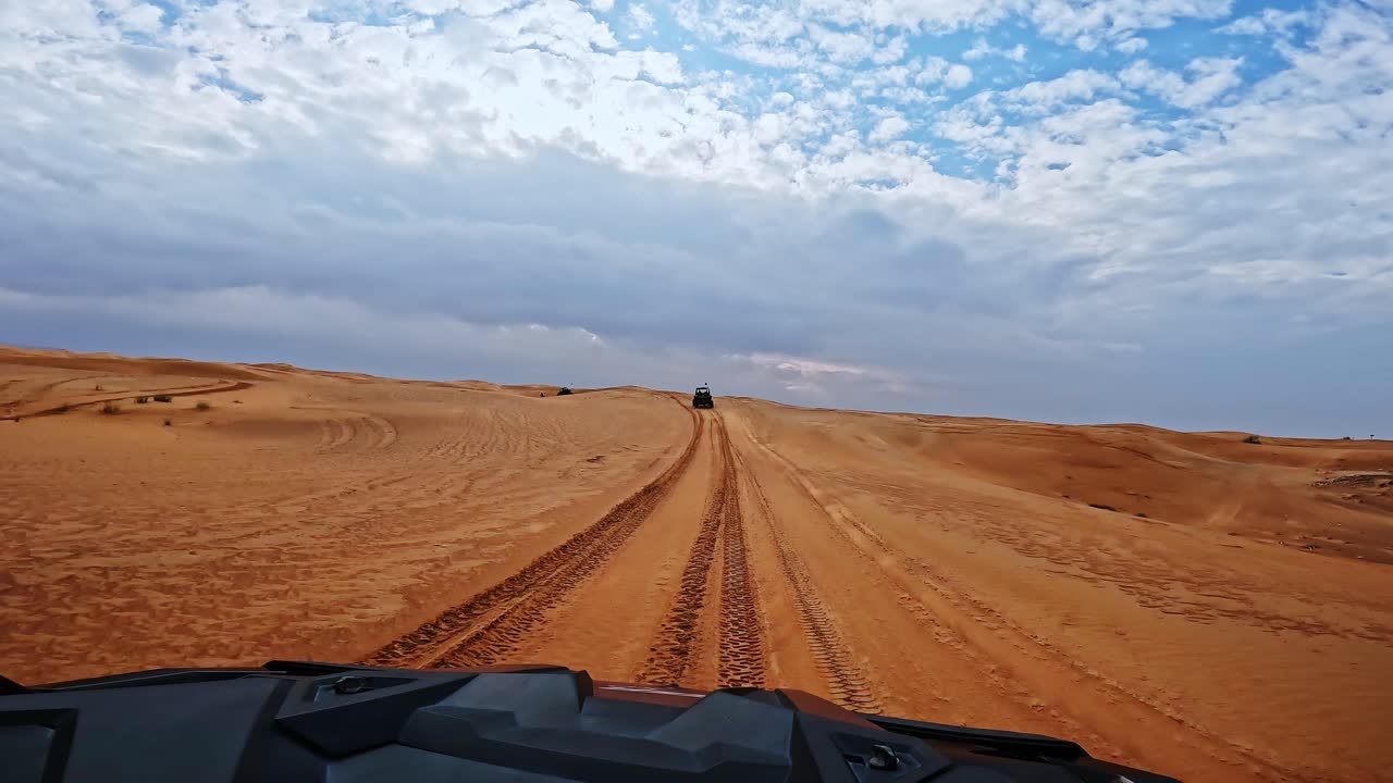 Thrilling Dubai desert ride with off-road vehicles racing across sandy terrain