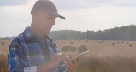 farmer using digital tablet at farm 6