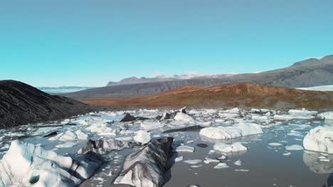 Icebergs-on-a-volcanic-shore-of-Skaftafell-glacier-lake-in-Iceland