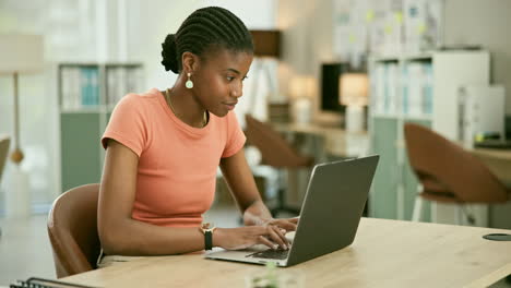 woman working on laptop in modern office