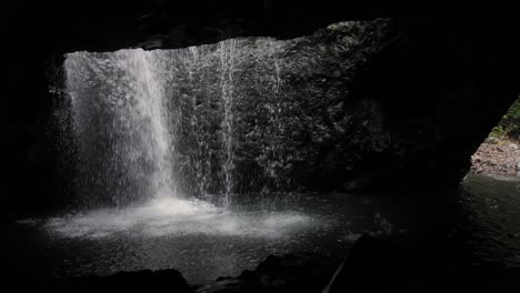 View-of-the-waterfall-in-Natural-Bridge,-Springbrook-National-Park,-Gold-Coast-Hinterland,-Australia