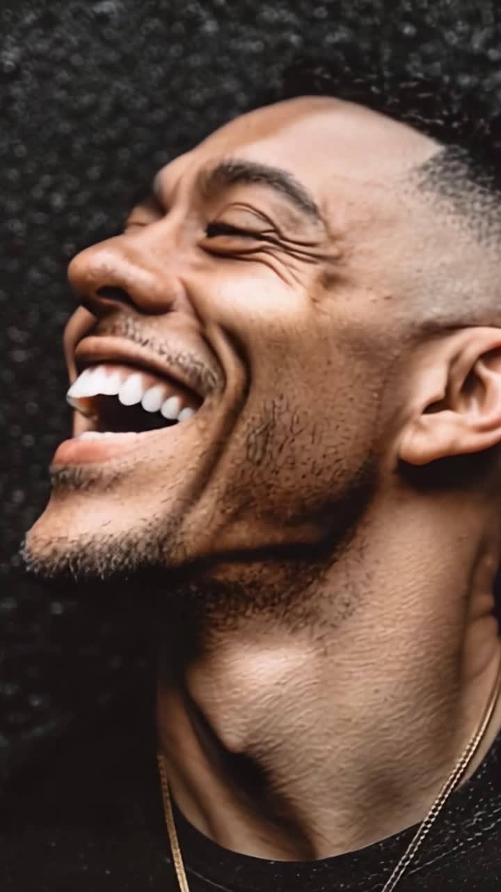 Joyful Expressions: Capturing the Essence of Happiness and Laughter Through Close-Up Shots of a Man's Radiant Smile and Genuine Emotion