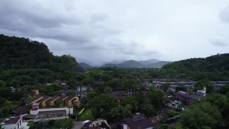 Aerial-view-rising-over-the-Barra-Do-Sahy-town,-in-cloudy-Saint-Sebastian,-Brazil