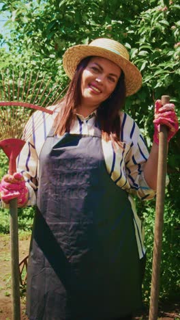 A Joyful Gardener in a Lush Vegetable Garden, Embracing Nature and Nurturing Plants with a Rake, Enjoying the Bright Sunshine and Vibrant Growth Around Her
