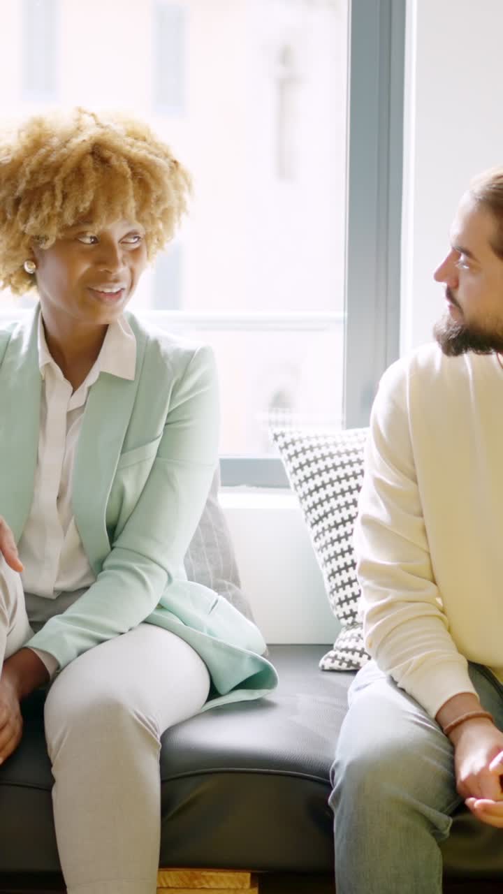 Coworkers talking distracted during a work break