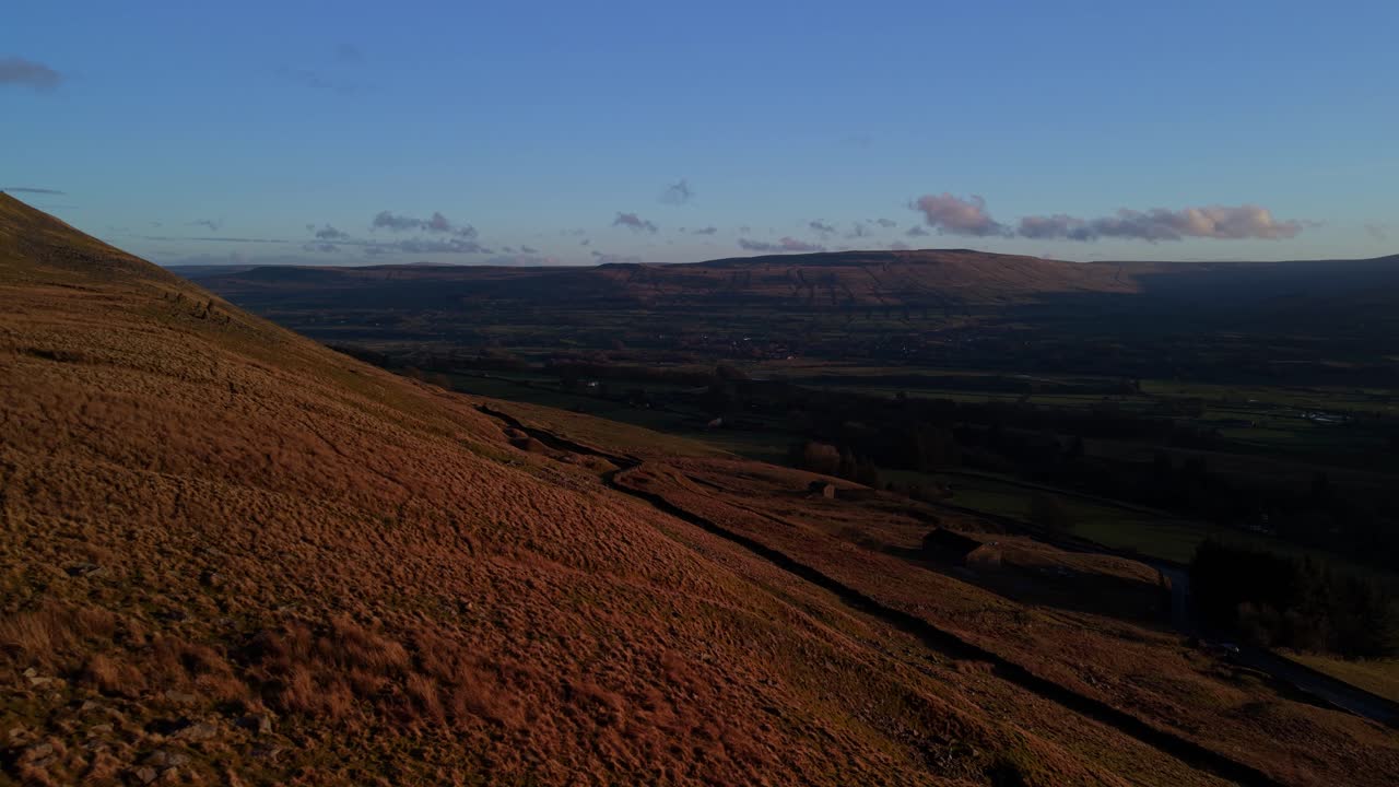 Sunset over rolling hills in Yorkshire Dales, evoking peace and solitude