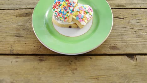 Heart-shape-cookies-in-plate-on-wooden-plank