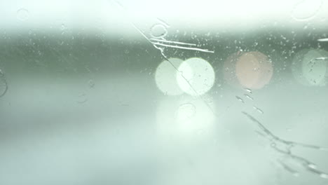 wet window of a car driving on a rainy day