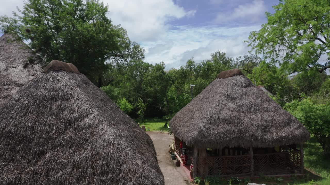 Aerial drone shot flying through a luxury lodge in Selous jungle, Tanzania. Sunny day