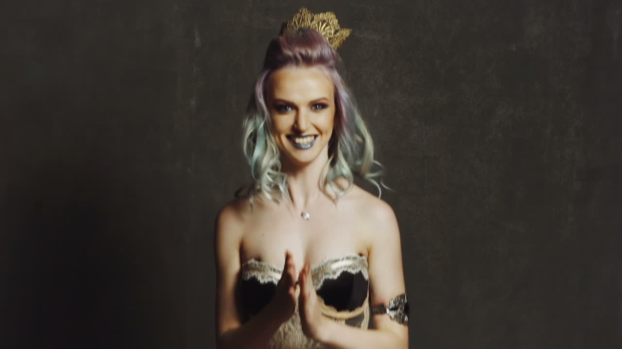 Woman play with soap balloon. Girl with glamour makeup and hair playing with soap balloon in studio