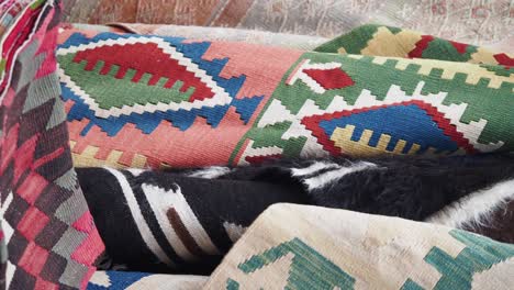 pile of colorful kilim rugs