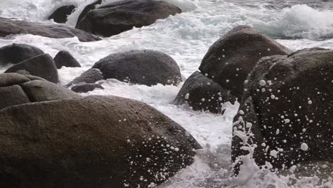 powerful ocean waves crashing against rocks