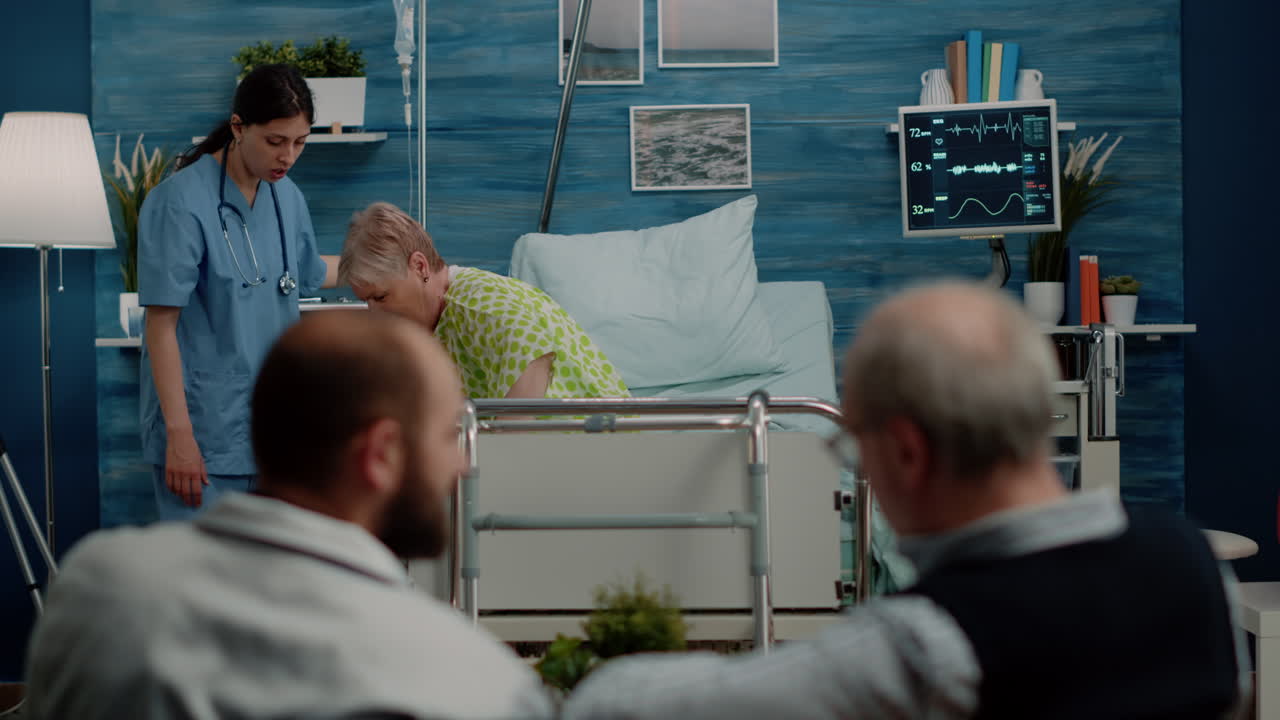 Nurse helping ill patient with IV drip bag and walking