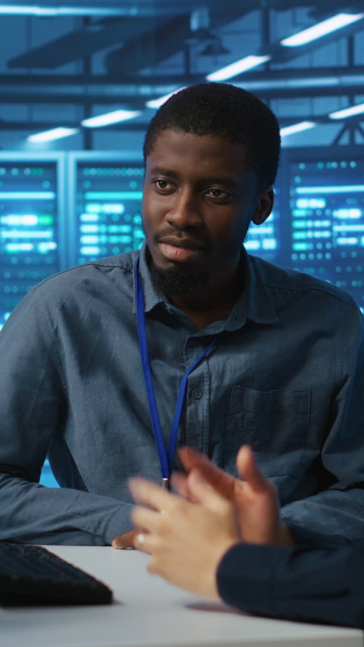 IT Technicians Discussing Server Operations in a Data Center