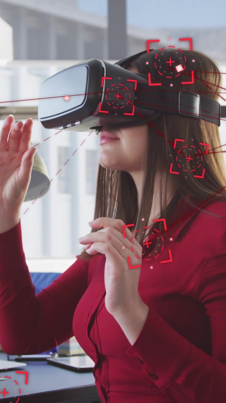 Vertical video: Adult woman lifting VR headset, adjusting strap, manipulating red HUD for tech demo