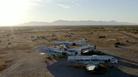 Abandoned-DC-5-Aircraft-in-Desert-Field-Aerial