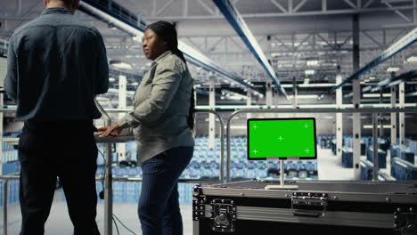 data center it professionals check ai dashboard using isolated screen tablet