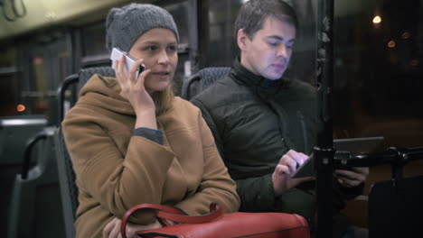 bus passengers using gadgets