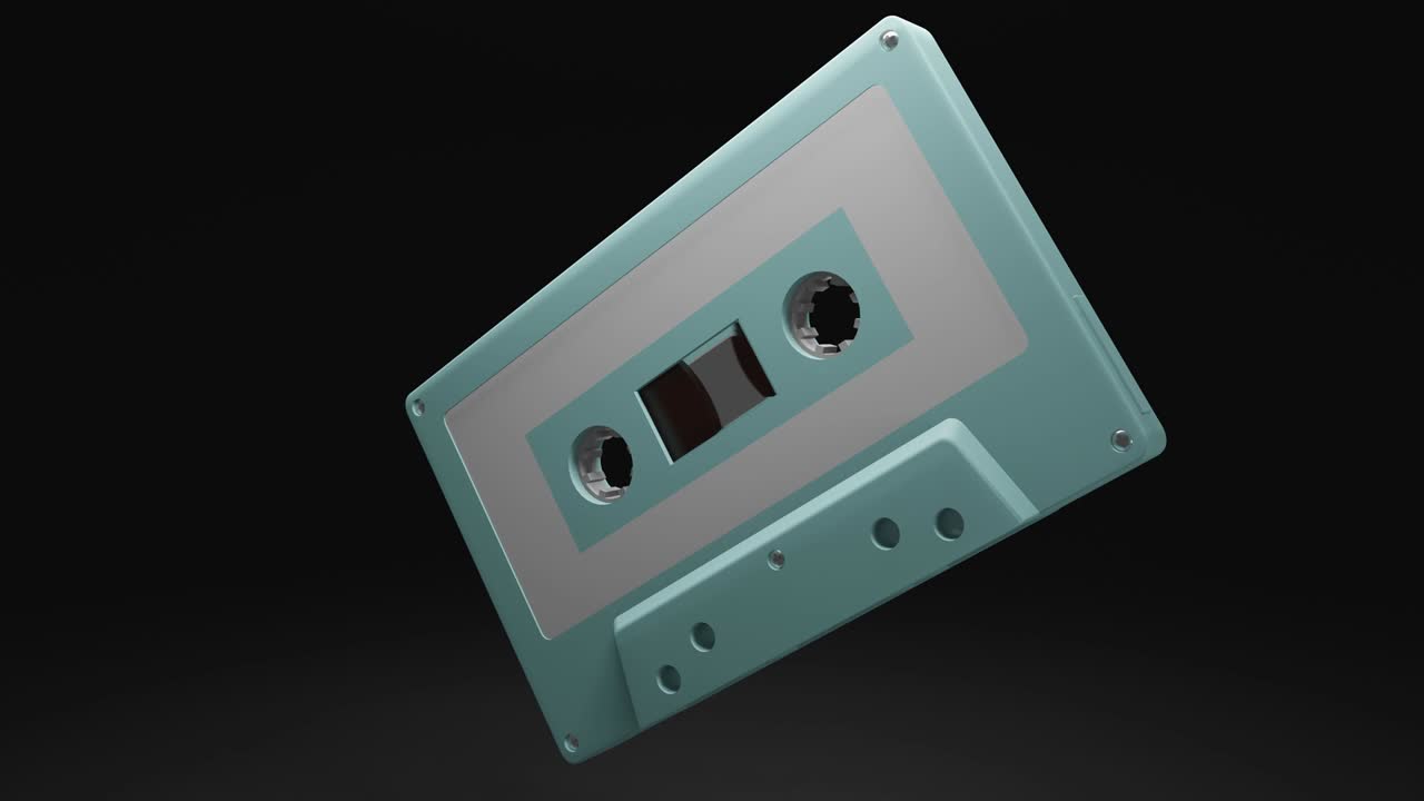 Pale blue cassette tape isolated on black background.