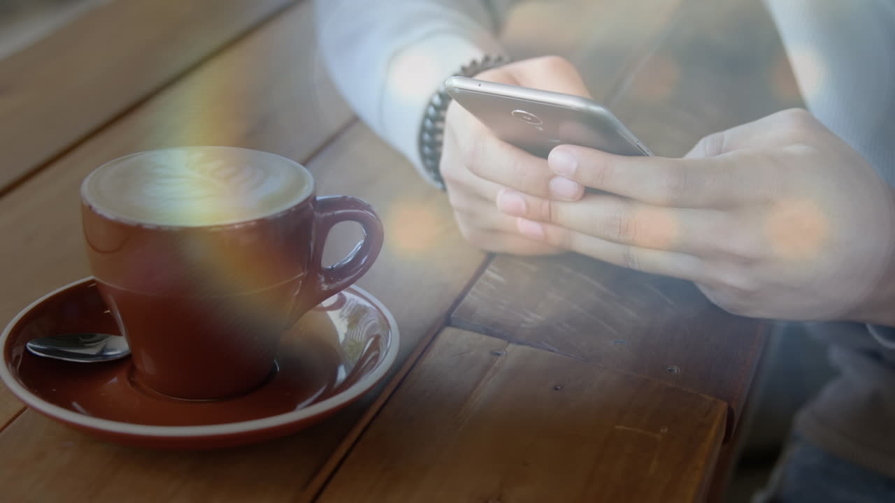 스마트 폰을 사용하여 손 위에 있는 빛 반점의 애니메이션