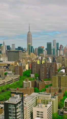 diverse buildings in new york panorama. city combining usual structures with skyscrapers and green parks. top view. vertical video