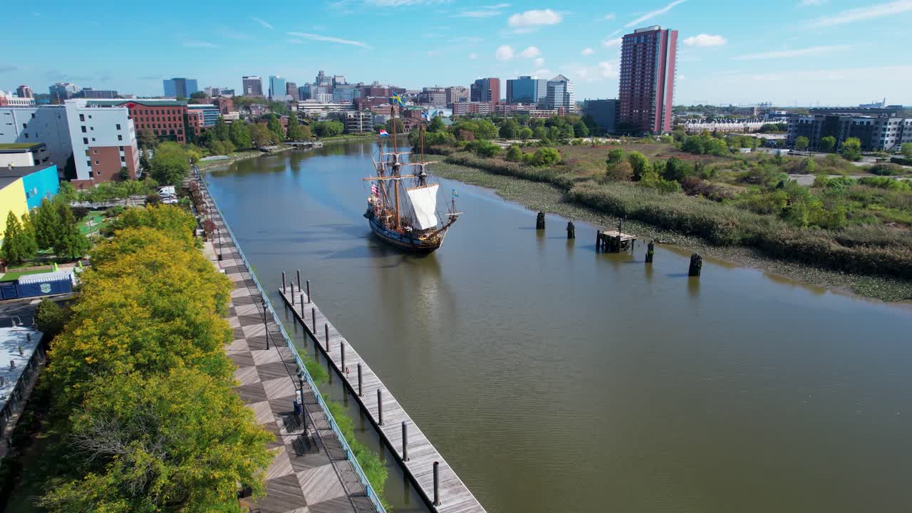 drone of Historic replica tall sailing ship coming up Christina River Wilmington Delaware
