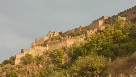 Low-angle-of-Sagunt-Castle-Ruins-during-sunny-day-in-Spain