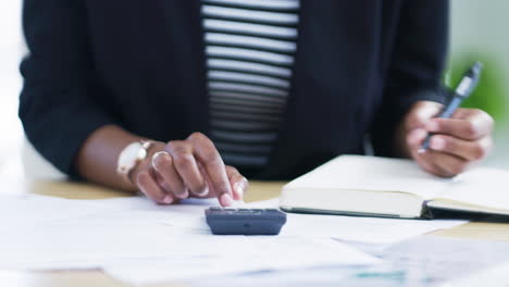 businesswoman calculating finances