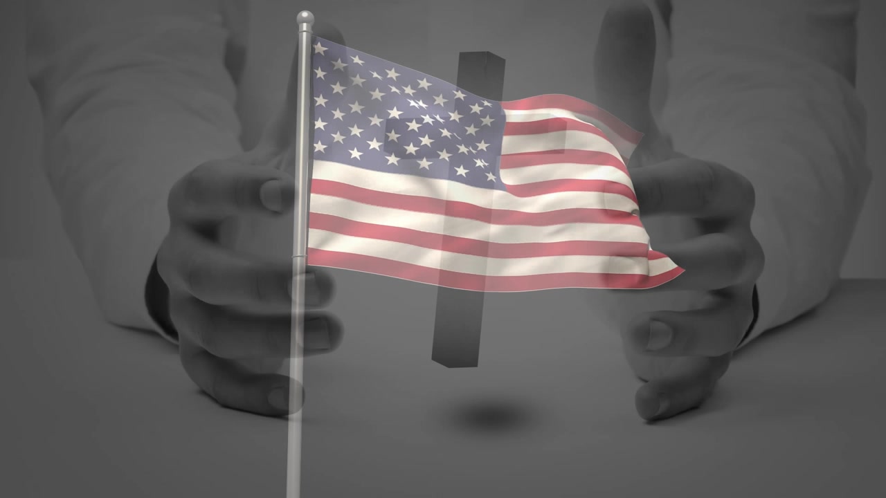 Hands entering frame starting floating cross and materializing waving American flag for tech demo
