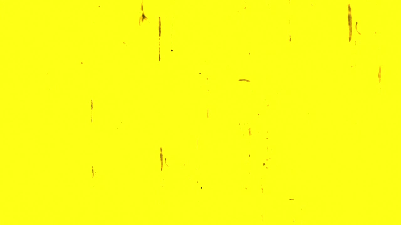 Vintage Film Texture with Scratches and Dust on Yellow Background