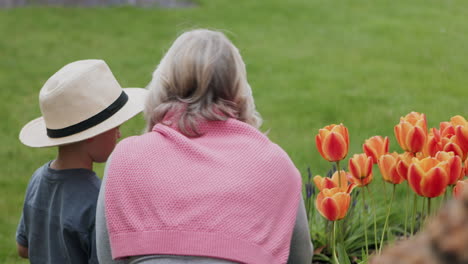 grandmother and grandson gardening together