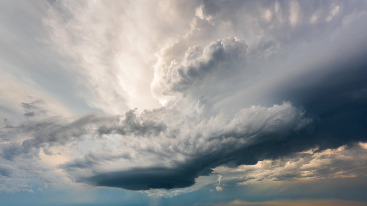 Storm clouds swirling and shifting in dark dramatic weather scene