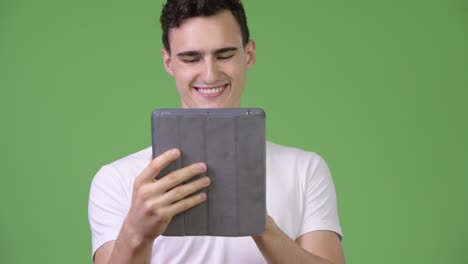 young handsome man using digital tablet
