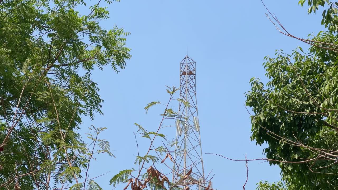Tall communication network tower standing tall in the sky