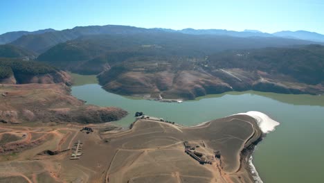 Sau-swamp-dike-in-Catalonia,-Spain,-intense-drought-in-2024-Drone-flight-over-desert-land,-dry-lake-in-Spain