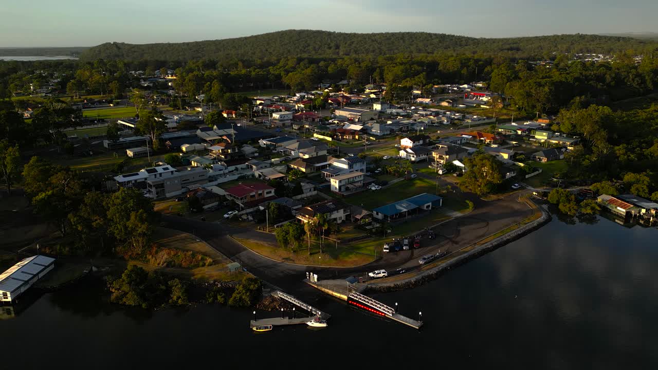 Left to right sunrise aerial view of the regional town of Karuah, New South Wales, Australia.